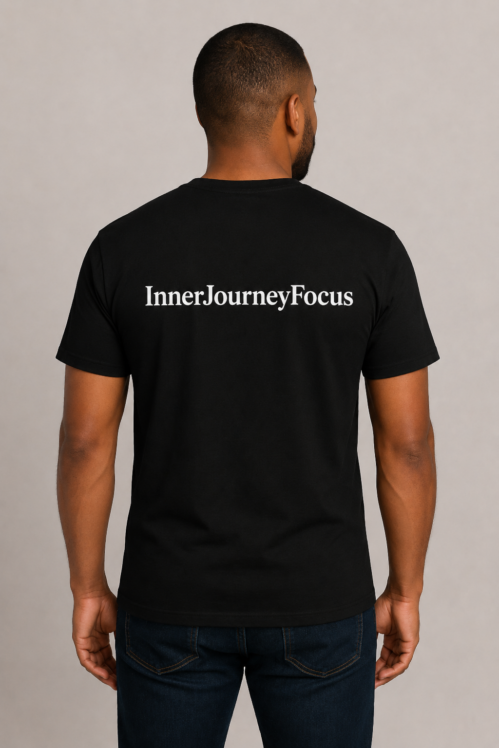 Man wearing black InnerJourneyFocus shirt, back view