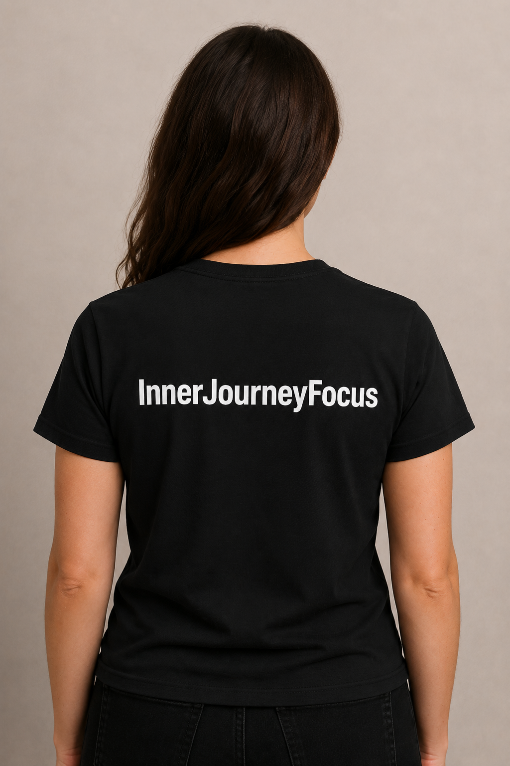 Woman wearing black InnerJourneyFocus shirt, back view